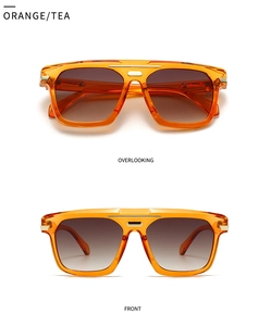 Detail of orange rectangle sunglasses with tea lenses and golden metal top bar