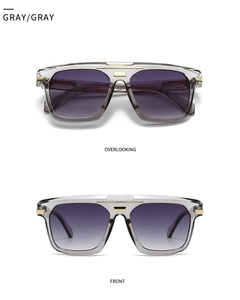 Overlooking and front view of gray oversized retro sunglasses with golden metal accents