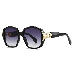 Modern hexagonal black sunglasses with purple gradient lenses and gold geometric hinges