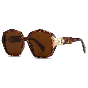 Modern retro tortoiseshell sunglasses with oversized frames and gold metal accents