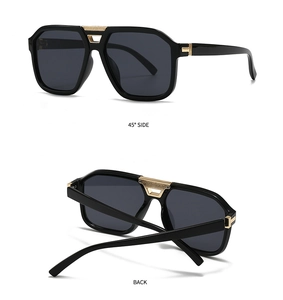 Detail view of modern pilot sunglasses featuring sleek black frame with gold metal hinges