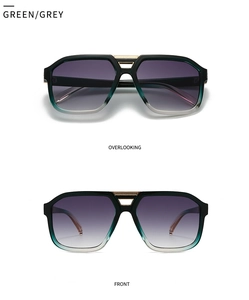 Detail view of retro oversized navigator sunglasses with green gradient frames and metal bridge