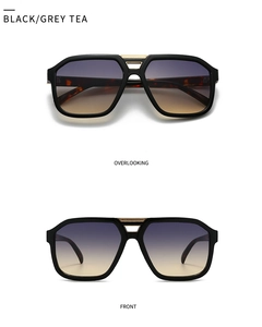 Detail of aviator sunglasses featuring gold metal bridge and tortoiseshell temples