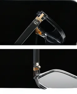 Macro shot of gold T-shape metal hinge on transparent grey square sunglasses frame