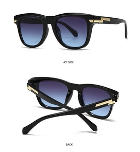 Detailsicht der großen schwarzen quadratischen Sonnenbrille mit goldener Blitzverzierung