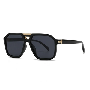 Modern retro oversized aviator sunglasses with black frames and gold metal accents