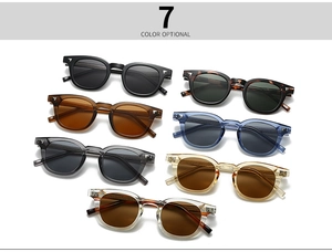 Flat lay of retro round sunglasses in seven colors including tortoiseshell and amber