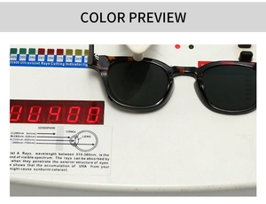Close-up of tortoise shell sunglasses under professional UV400 protection testing process