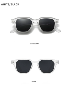Detail view of modern retro sunglasses with frosted white frames and black lenses