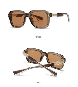 Detail of vintage square sunglasses with geometric embossed metal hinges and tinted lenses