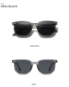 Front and top view of gray and black polygon sunglasses with metallic rivet details
