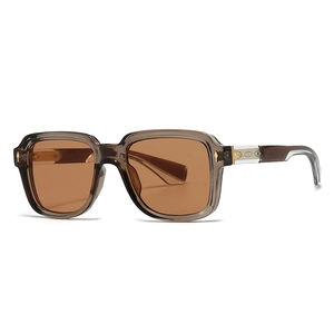 Modern oversized square sunglasses with transparent grey frames and amber tinted lenses