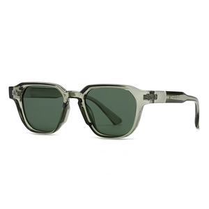 Modern retro round sunglasses with translucent grey-green frames and dark green lenses