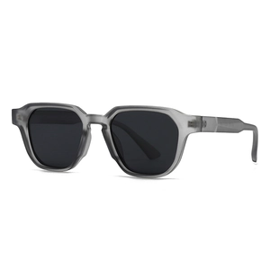 Modern retro round sunglasses with translucent gray frames and dark gray lenses
