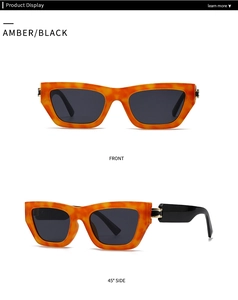 Detail display of amber tortoiseshell square sunglasses with black lenses from 45 degree angle
