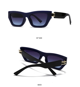 Detail view of square sunglasses featuring blue frames, gradient lenses and gold metal hinges