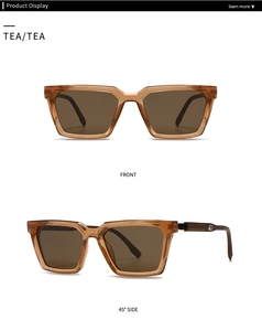 Détail des lunettes de soleil en acétate marron thé avec logo argenté sur la branche
