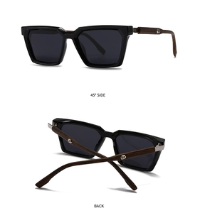 Détail de lunettes de soleil noires avec branches motif bois et logo hexagonal en métal