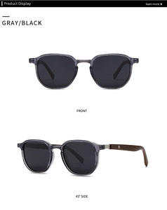 Detail of retro sunglasses showing gray transparent frame and wooden temple with logo