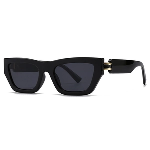 Retro square oversized black sunglasses with gold metal hinges on a white background