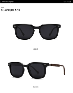 Close-up of black round sunglasses with wood grain temples and silver arrow detail