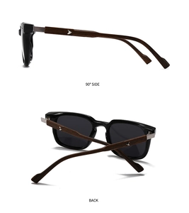 Detail of round sunglasses featuring black frame and wood grain temples with arrow hardware