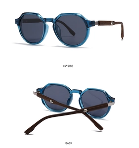 Detail of blue translucent polygon sunglasses showing wooden temples and metal logo