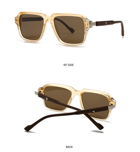 Detail der runden Champagner-Sonnenbrille mit Bügeln in Holzoptik und Metallverzierung