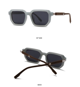 Detail view of translucent gray geometric frames and natural wood temples with metal accents