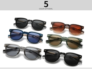 Detailed view of colorful retro acetate sunglasses featuring decorative metal arrow rivets
