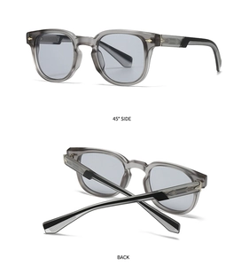 Detail view of vintage small frame sunglasses with taupe acetate and silver arrow rivets