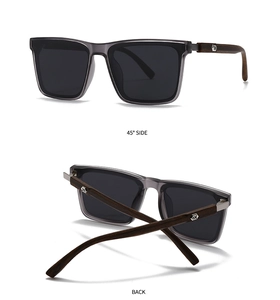 Detail view of polarized sunglasses with grey frames and wooden textured temples