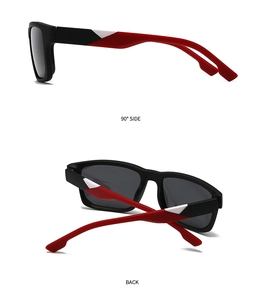 Detail view of square sunglasses featuring black matte frame and red white temple accents