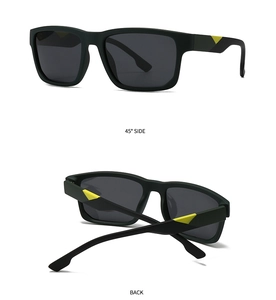 Detail of matte black rectangular sunglasses featuring yellow triangle hinge accents