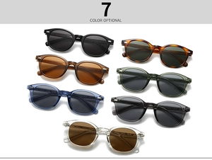 Flat lay of retro round sunglasses in seven colors featuring metal rivet details