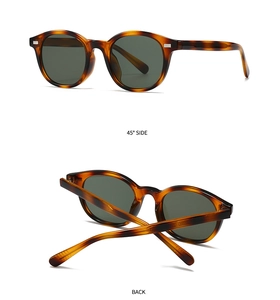 Detailed views of vintage tortoiseshell round sunglasses with dark tinted lenses