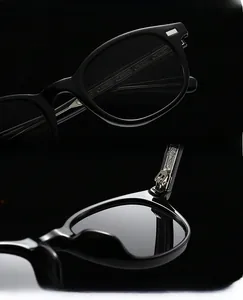 Detail showing the durable metal hinge and smooth frame texture of vintage sunglasses