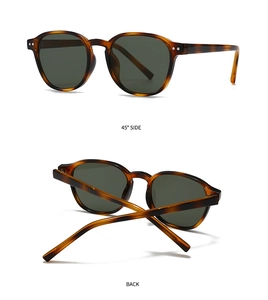 Detail view of vintage round sunglasses with tortoiseshell frame and metallic rivets