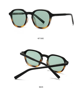 Detailed views of vintage round sunglasses with black to tortoiseshell frames and green lenses