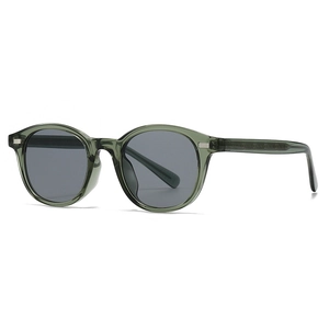 Retro round sunglasses with translucent dark green frame and grey lenses in a 45-degree view