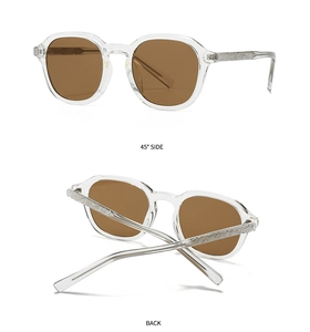 Detail of trendy retro sunglasses featuring diamond-patterned temples and brown lenses