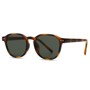 Retro round tortoiseshell sunglasses with dark green lenses and metal rivet details