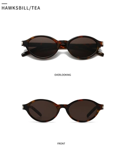 Macro view of tortoiseshell oval sunglasses with silver temple accents and tea lenses