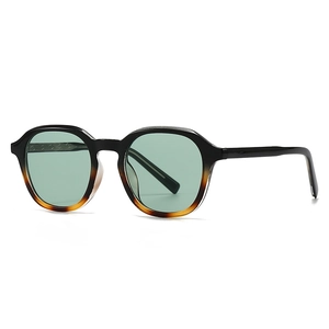 Vintage gradient black and tortoiseshell sunglasses with translucent green lenses
