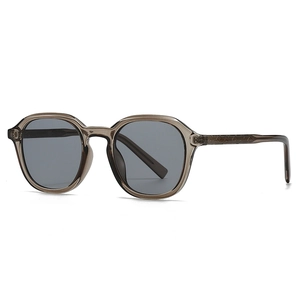 Retro taupe transparent resin sunglasses with dark grey lenses and textured temples