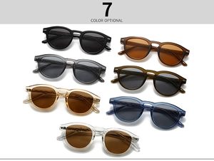 Flat lay of retro round sunglasses in seven trendy colors with keyhole bridge
