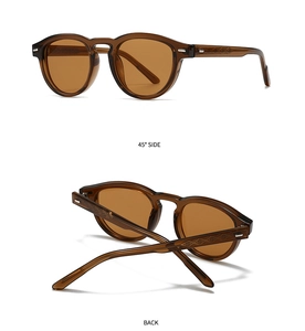 Detail view of retro amber sunglasses featuring textured temples and brown tinted lenses