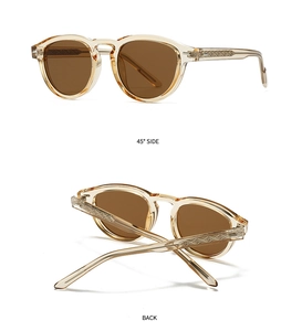 Detail of vintage amber round sunglasses with textured temples and dark brown lenses