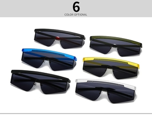 Detailed flat lay of six colorful oversized shield aviator sunglasses with gradient lenses