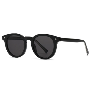 Retro black round sunglasses with silver diamond rivets on a clean white background